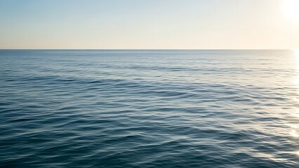 Fototapeta premium Vast Ocean Horizon with Gentle Ripples Reflecting the Sunlight