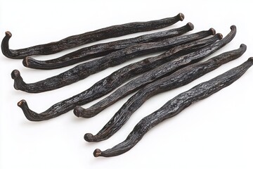 Close-up of cured vanilla pods arranged on a white background, rich aromatic and inviting culinary spice