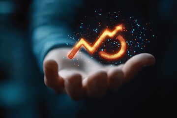 open hand presenting a glowing orange upward trend arrow with floating sparks and blue particles, conveying hope, empowerment and growth