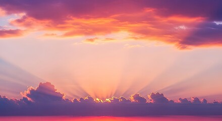 A vibrant sunset with a dramatic sky and scattered clouds, casting a warm glow over the ocean.
