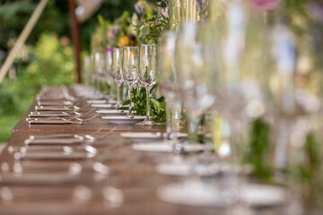 Elegant Outdoor Event Table with Champagne Glasses and Shallow Depth of Field