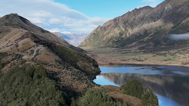 Aerial View of Winding Road and Lake Moke in New Zealand
