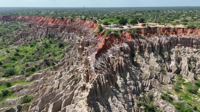 Cinematic drone shot over the unique eroded cliffs of Miradouro da Lua (Viewpoint of the Moon) in Belas Municipality, Luanda Province, Angola, Africa aerial footage