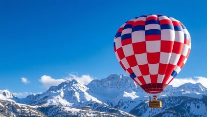 Hot air balloon over snowy mountains