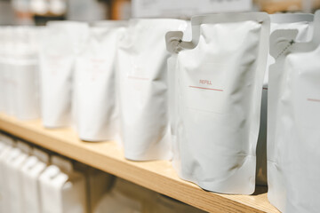 Refill packet. Zero waste. Reuse reduce recycle concept. refill liquid soap, shampoo and other products. Plastic packaging for refill pouch in store.