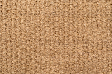 Natural woven jute texture background, close up of brown burlap fabric pattern. High-resolution close-up of a natural woven fiber texture.