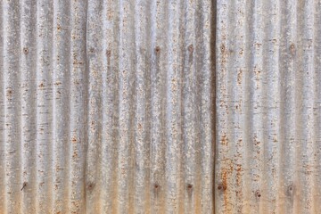 Old zinc surface background or the tin roof background with the rust