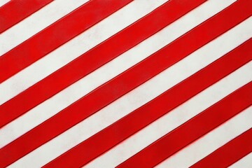 Fototapeta premium Diagonal red and white painted stripes on a textured surface, bold energetic graphic pattern