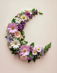Obraz premium Beautiful crescent moon shape made from a variety of fresh spring flowers.