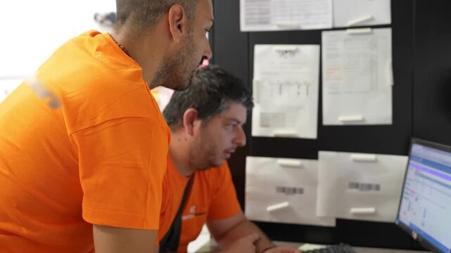 Office staff working diligently in an electrician company&rsquo;s modern office environment