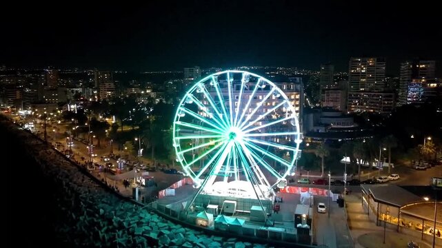 Ferris wheel in the city night lights