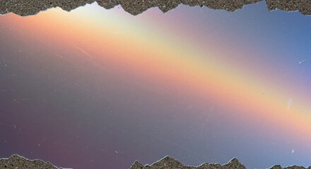 Fototapeta premium Rainbow Reflection in a Puddle: Witness nature's artistry as a vibrant rainbow is exquisitely mirrored in the still water of a puddle, framed by the rough, textured edges of the ground.