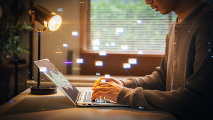 A man working on a laptop at night with digital email icons floating above the screen, representing digital communication, email marketing, and remote work connectivity.