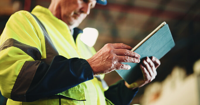 Tablet, hands and mature man in warehouse with email for cargo information with supply chain. Digital technology, industry and logistics manager with online inventory for stock delivery from below.