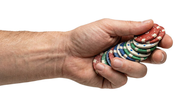 Male hand holding a stack of colorful casino chips