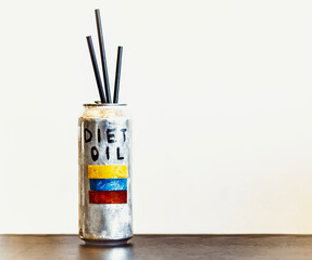 Silver Can Labeled &ldquo;Diet Oil&rdquo; with Three Black Straws and Venezuelan Flag &ndash; Satirical Concept