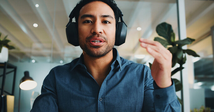 Businessman, portrait or video call with headphones in office for virtual meeting or webinar. Male person, POV or consultant talking with advice for online discussion or presentation in workplace