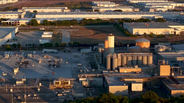 Aerial view of Large industrial complex of Brewery under evening light in the suburbs of Fort Worth, Texas.