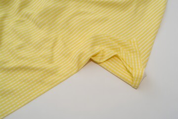 Yellow Checkered Fabric Texture Background with Soft Folds for Fashion Textile and Design Use