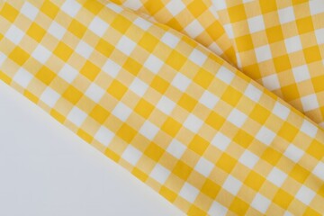 Yellow Checkered Fabric Texture Background with Soft Folds for Fashion Textile and Design Use