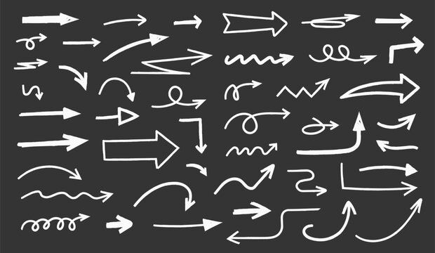 Hand drawn chalk sketched arrows of different shapes and directions on black background