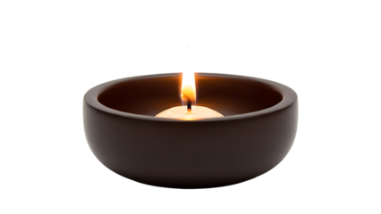 Lit candle in dark bowl on transparent background