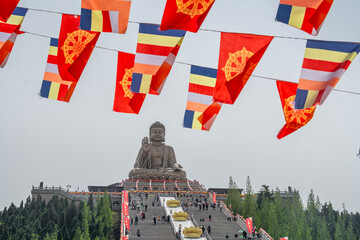Flags on the foreground of Nanshan great Buddha, in China.