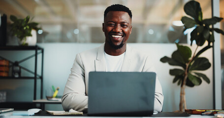 Portrait, laptop and happy with business black man in office for planning, account review and...