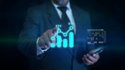 Businessman pointing at ETF (Exchange Traded Funds). Investment Opportunities in Mutual Funds and ETFs, Growing Wealth in the Financial Market.