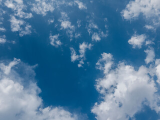 fluffy white clouds in a blue sky