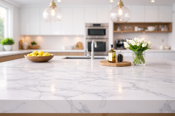 Marble kitchen island surface with lemons, flowers and bottles, blurred modern white kitchen in background. Bright elegant interior with copy space, perfect for food, product or lifestyle mockups.