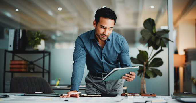 Finance, review or man in office with tablet, funding ideas or data analysis for budget pitch. Research, paper and analyst in workplace with tech, online report or proposal update for investment plan