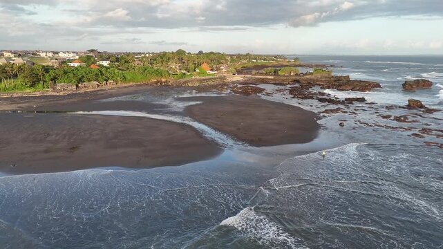 Bali beach called Prerenan north of Canggu I have recorded this drone footage at first sunlight at 5am, waiting for the sun to come up over the horizon, hitting all the notes from pink to orange, whil