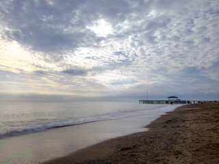 serene sunset scene with an old pier and calm sea