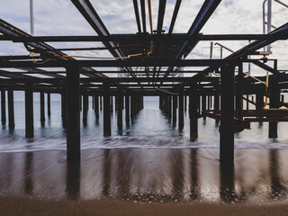 serene sunset scene with an old pier and calm sea