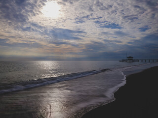 serene sunset scene with an old pier and calm sea