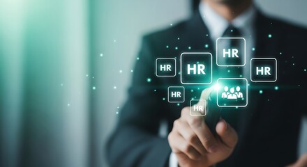 Professional interacting with digital human resources interface and glowing screen elements