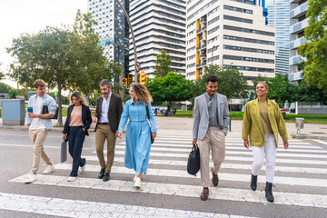 Diverse business people crossing urban street together