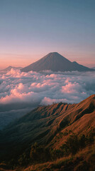 Clouds Rolling Over Volcano Mountain in Indonesia with Dramatic Tropical Landscape and Natural Atmosphere