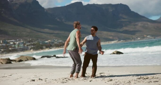 High five, chest bump and friends on beach for fitness, wellness or health with exercise achievement. Support, happy and men with celebration for workout or training with teamwork by ocean in morning
