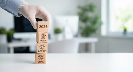 2026 business plan action goal, Wooden cubes strategy stack, Hand placing 2026 yearly block, Business objective success icons