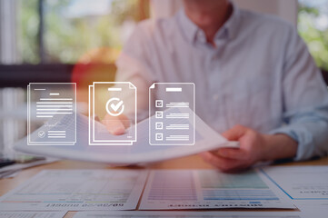 Businessman reviewing and hand over paper report with electronic files icons, utilizing intelligent management system final approvals, Digital document workflow and quality assurance