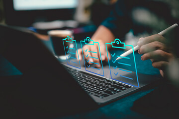 Digital checklist interface on laptop with person using stylus for task management