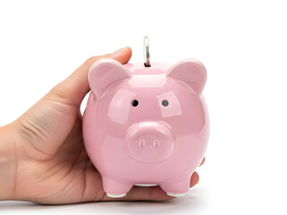Hand holding pink piggy bank with coin slot open on white background