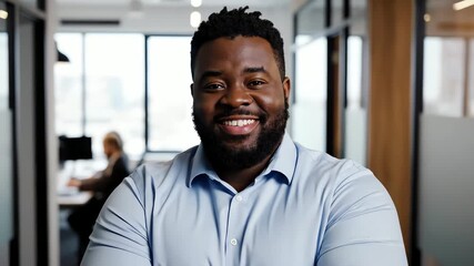 Confident team leader portrait in open office.