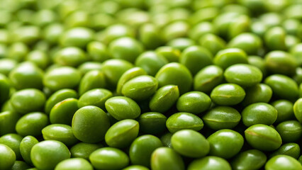 Fresh green peas scattered on a surface ready for cooking or snacking during the daytime in a kitchen or market setting