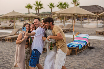 Group of friends taking a selfie enjoying beach party vacation