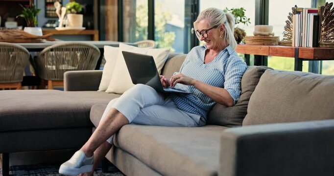 Happy woman, sofa and journalist typing with laptop for online story, article or magazine in home. Mature person, freelancer or remote work with computer for journalism, research or publish in house
