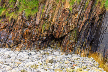 Wet rocks on a beach in low tide