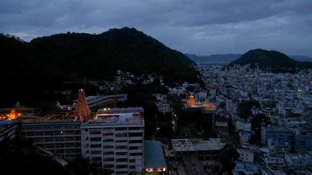 Aerial view of Famous hindu godess Kanaka Durgha temple on the hills in the Vijayawada city , Andhra Pradesh state of India during twilight.